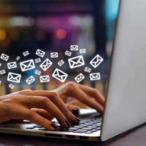 hands on a laptop with email illustrations